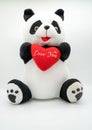 Panda doll and red heart Ã¢â¬Ålove youÃ¢â¬Â isolated on white background